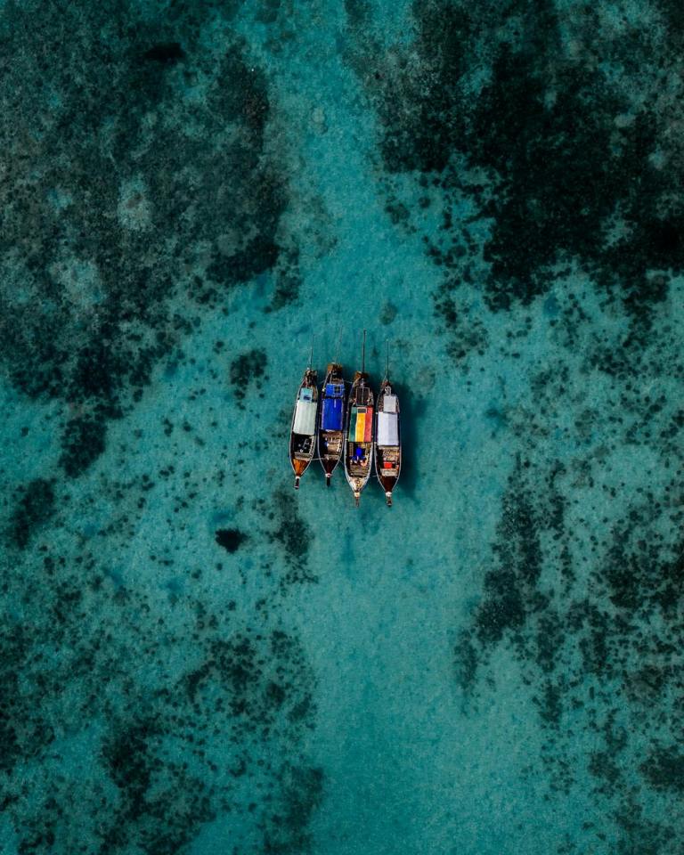 four boats on sea