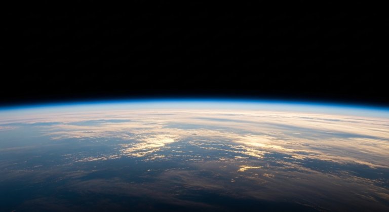 Aerial view of Earth's stratosphere with reflective aerosol haze scattering sunlight along the atmospheric horizon
